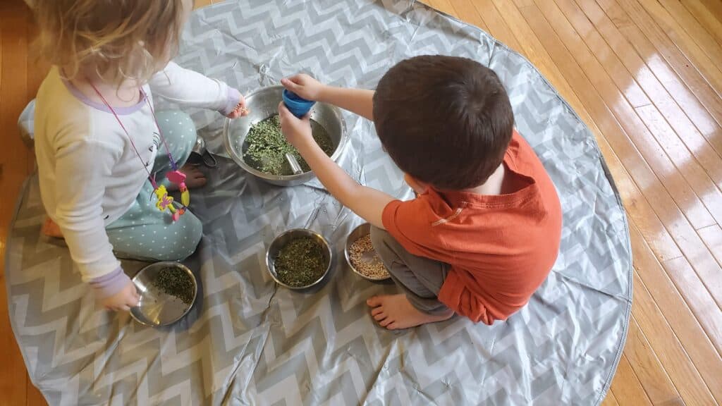 Herbs, water, and funnels make a great nature-based playtime in our preschool homeschool routine.